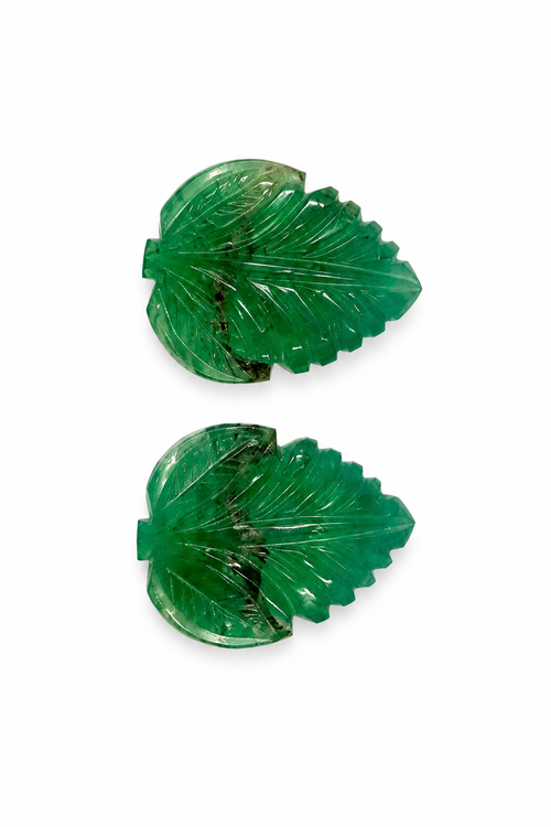 Pair of matched leaves hand-carved from natural emerald, 54 carats total, with fine vein detail