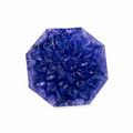 Octagonal natural tanzanite carved with a concentric lotus in relief, 102 carats